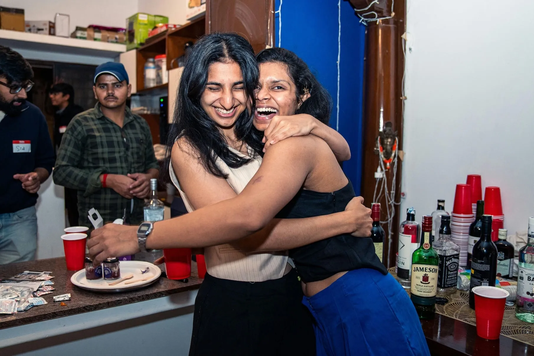 A hug by the bar